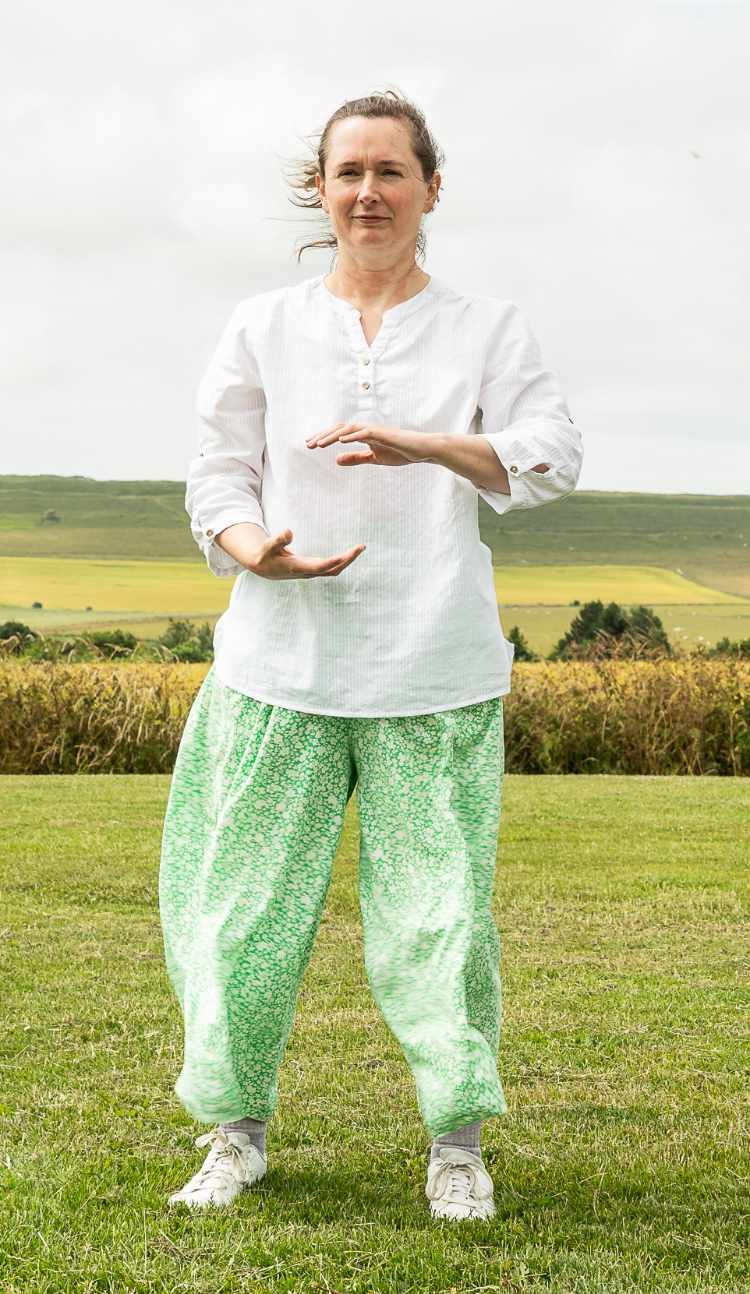 Françoise doing Chi Flow exercises outdoors